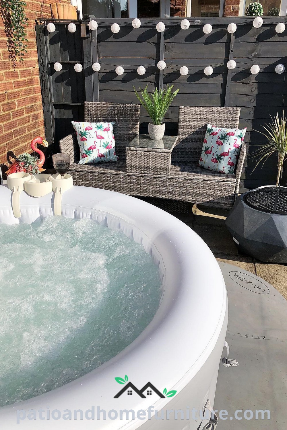 A cozy hot tub on a patio surrounded by a wooden bench and potted plants, providing a relaxing and inviting outdoor retreat with design ideas from wellnesswink.com.