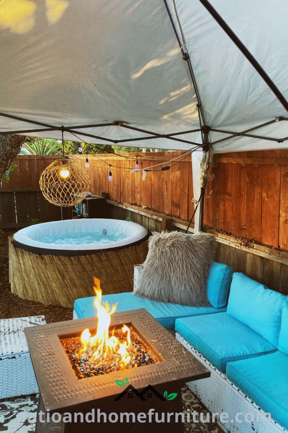 Cozy backyard featuring an outdoor hot tub and fire pit, surrounded by wood-paneled walls and blue couches with pillows, showcasing inviting decor ideas for relaxation and social gatherings. Visit wellnesswink.com for more unique ideas.