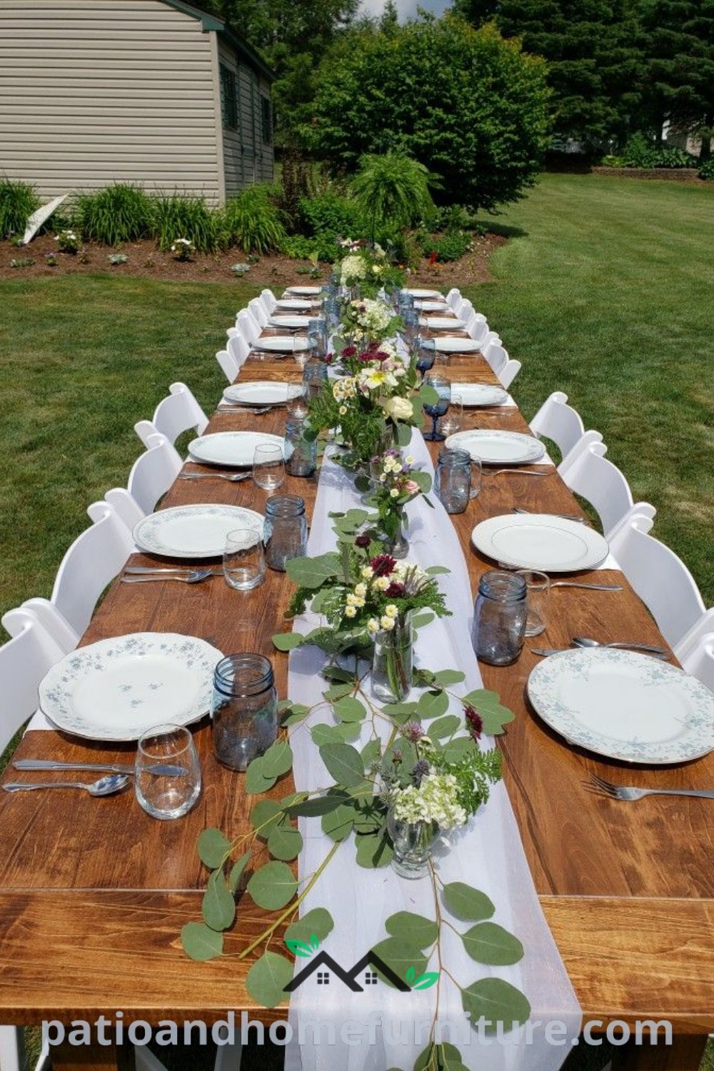 Long wooden table set for an outdoor micro wedding reception, beautifully decorated with plates and flowers, creating a cozy and inviting atmosphere for a small celebration, shown on wellnesswink.com.