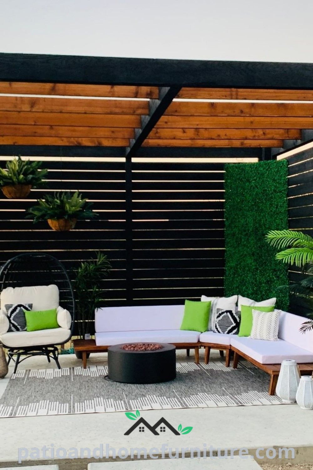 Cozy outdoor living area with a modern wooden pergola, featuring comfortable couches, decorative tables, and vibrant potted plants, offering inspiring ideas for a perfect backyard retreat, found at wellnesswink.com.