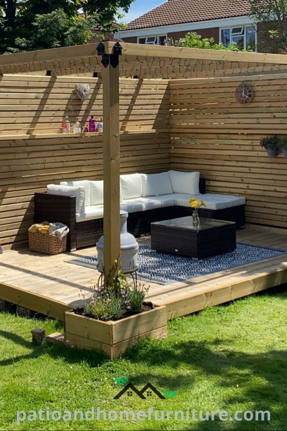 Cozy outdoor living area with wooden decking and white couches under a homemade pergola, offering design ideas for relaxation and entertainment in a backyard setting, as featured on wellnesswink.com.