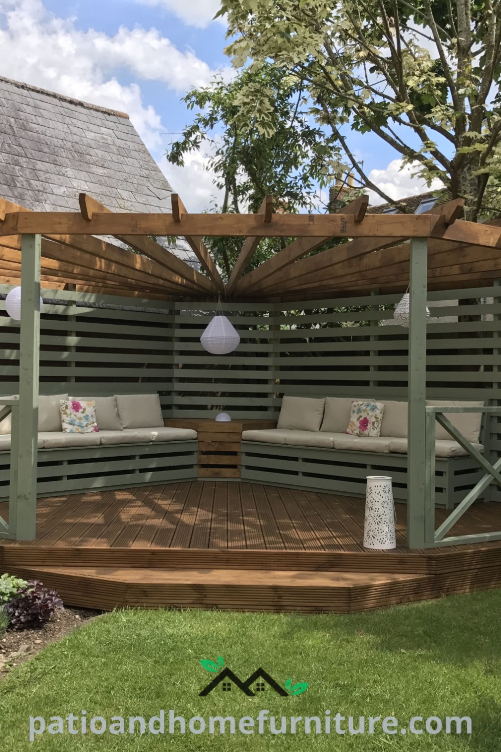 Wooden deck with benches and chairs under a pergola in a backyard, showcasing cozy ideas and design inspirations for an inviting outdoor space on wellnesswink.com.