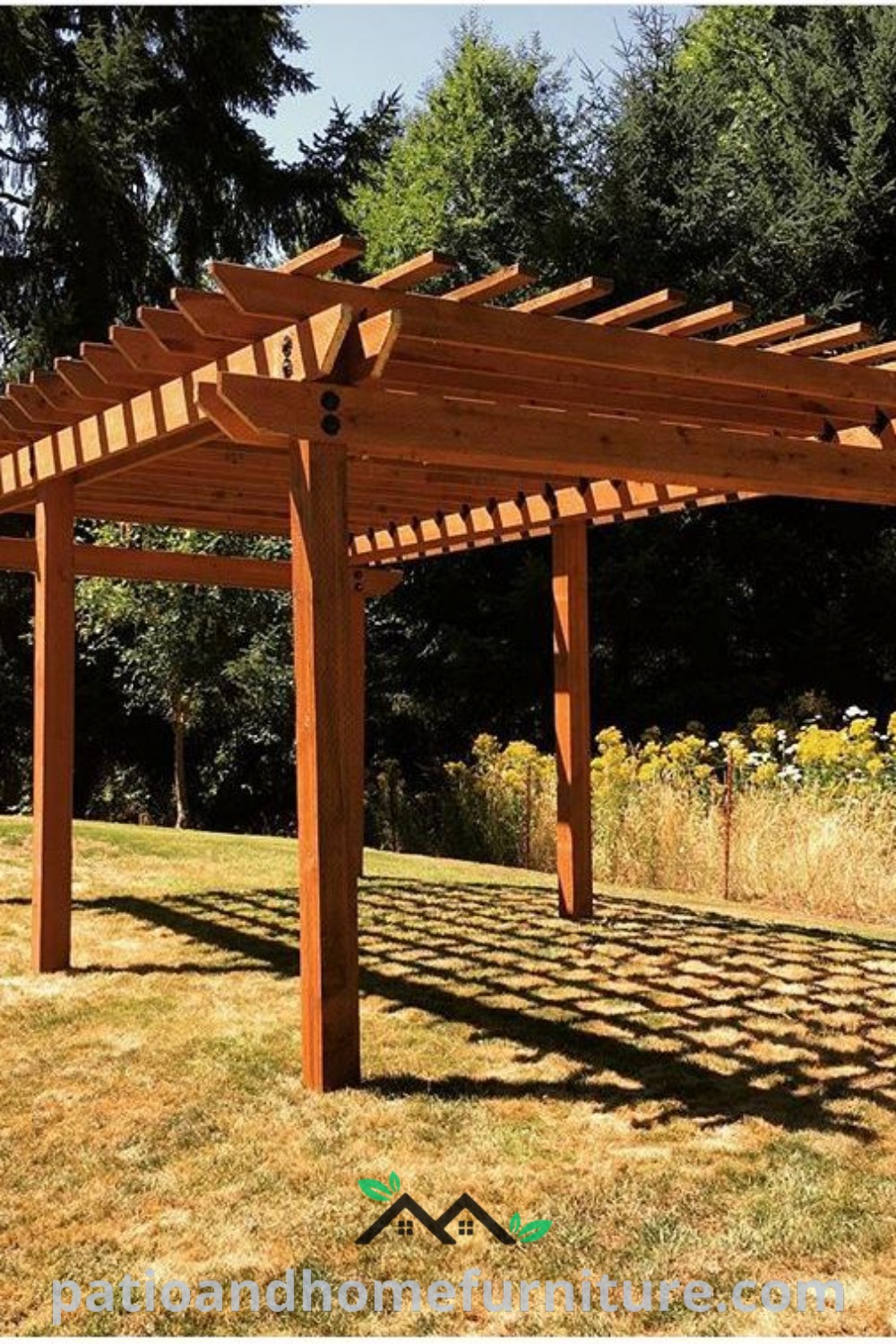 Wooden pergola situated in a green field with trees, creating a cozy outdoor setting, showcasing unique design ideas and decor inspirations for an inviting home atmosphere, featured on wellnesswink.com.